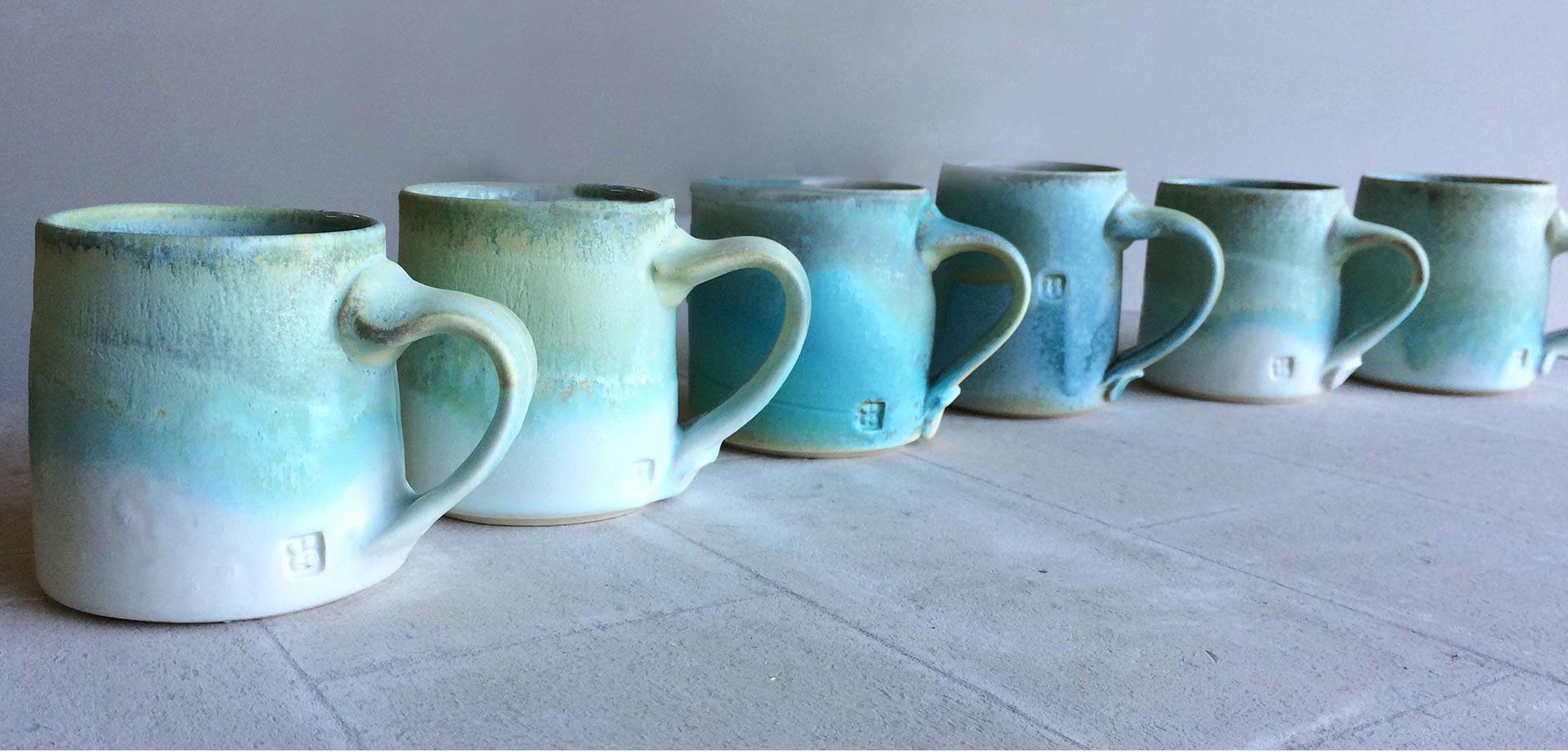 cori sandler row of mugs